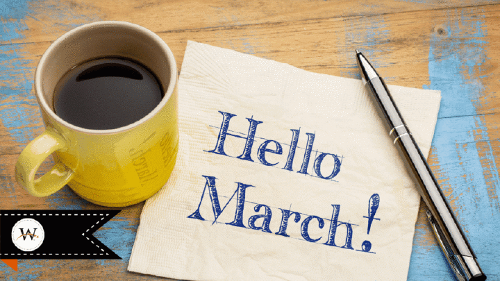 "Hello March" on piece of paper under coffee cup